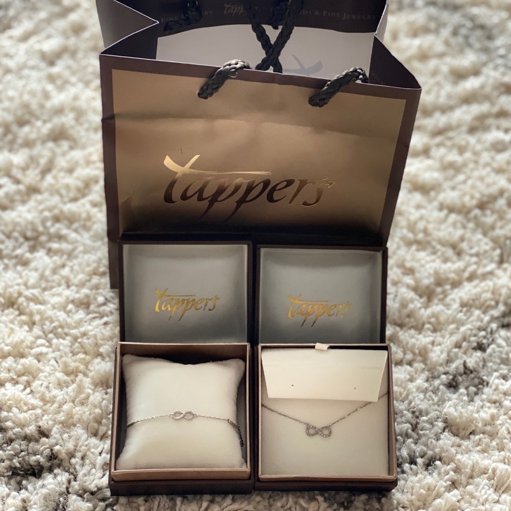 Tappers sterling silver diamond infinity necklace and matching bracelet.